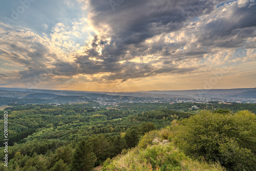 View of the mountains and Kislovodsk from the observation decks of the Kislovodsk Park. Evening sunset over the mountains of Kislovodsk.
