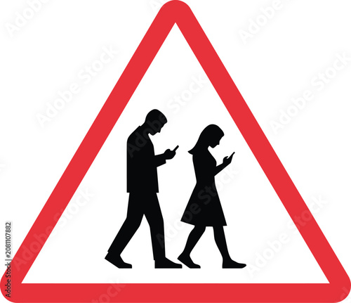 Warning road sign showing a man and woman walking while using mobile phones