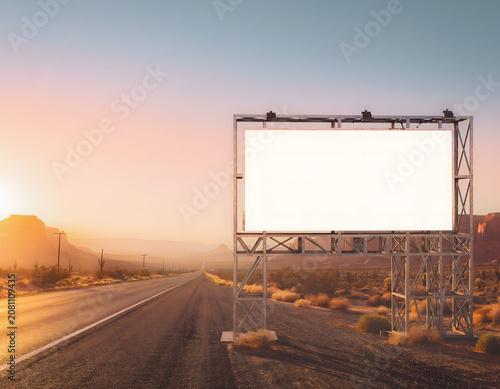 Empty Blank Billboard Sign Frame Standing Along a Desert Highway at Sunset for Advertising Mockup
