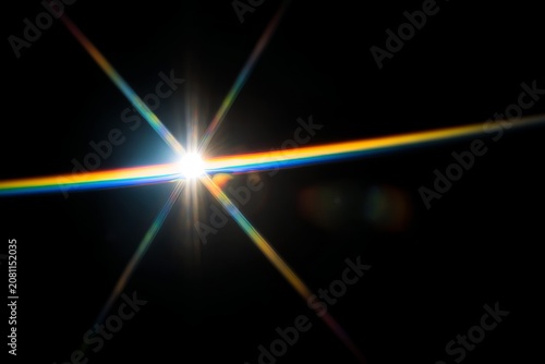 Brilliant Starburst of Light with Rainbow Colored Lens Flares.