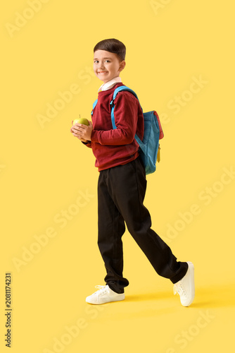 Little schoolboy with apple...