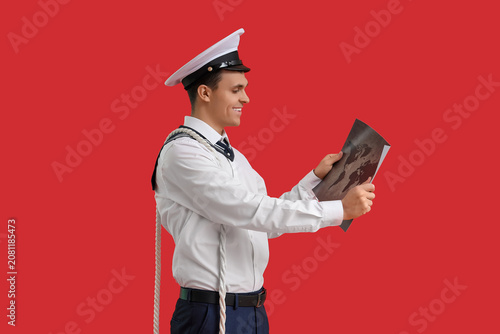Young sailor with rope and ...