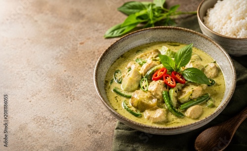 **Authentic Thai Green Chicken Curry with Coconut Milk, Thai Eggplant, Green Beans, Fresh Basil, Red Chili and Steamed Jasmine Rice, Hyper-Realistic Food Photography with Copy Space** - 1