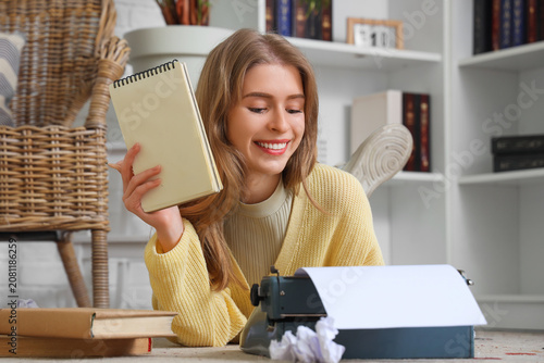 Female author with notebook...