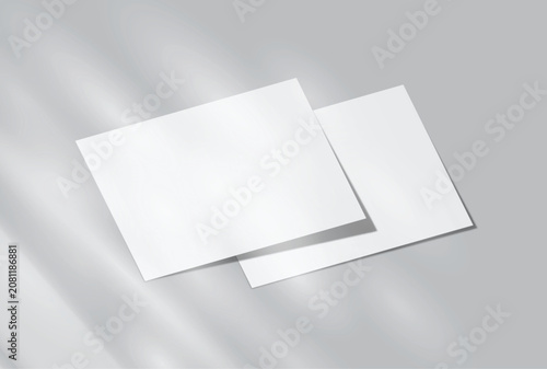 Blank white A4 paper sheets mockup on background with elegant organic shadow overlay. Perfect for displaying stationery designs, flyers, posters, branding, Ads and print design presentations