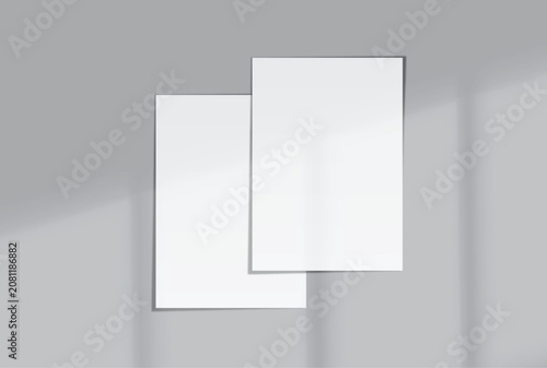 Blank white A4 paper sheets mockup on background with elegant organic shadow overlay. Perfect for displaying stationery designs, flyers, posters, branding, Ads and print design presentations