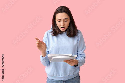 Shocked young woman with ma...