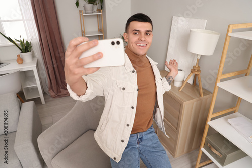 Young man with mobile phone...