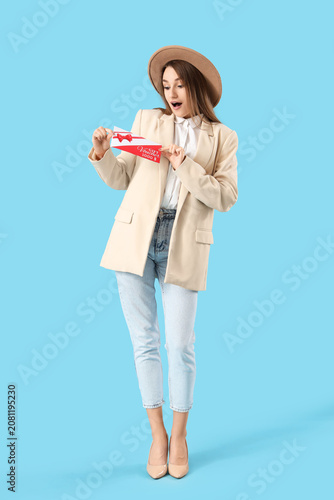 Happy young woman with gift...