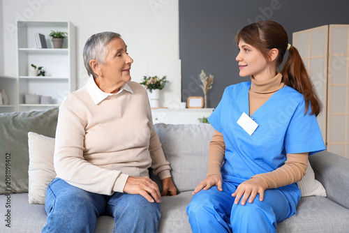 Senior woman with caregiver...