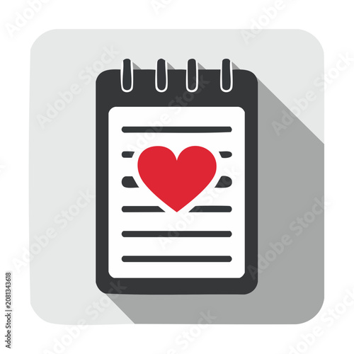 Notepad with red heart icon on lined paper