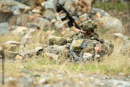 Konstfotografi Military personnel practice movement, evasion, and taking cover after a simulate