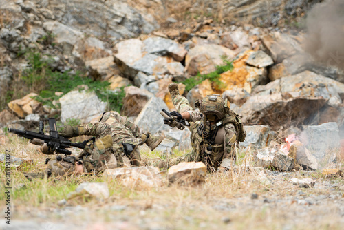 Canvastavla Military personnel practice movement, evasion, and taking cover after a simulate