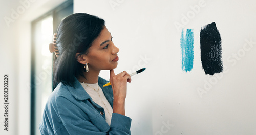 Thinking, woman and paint sampling on wall for color choice, home renovation and test coating. Interior design, homeowner or decision with paintbrush for house makeover, undertone option or diy decor
