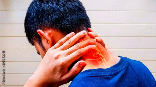 Rear view of a man holding his neck in pain with a red glowing cervical spine graphic, illustrating neck pain, muscle strain, cervical spondylosis, and posture awareness.