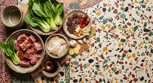 Taiwanese beef noodle soup ingredients on vintage terrazzo floor