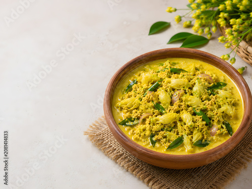 Traditional Kathurumurunga Flower Curry Served in a Clay Bowl on a Light Background with Copy Space