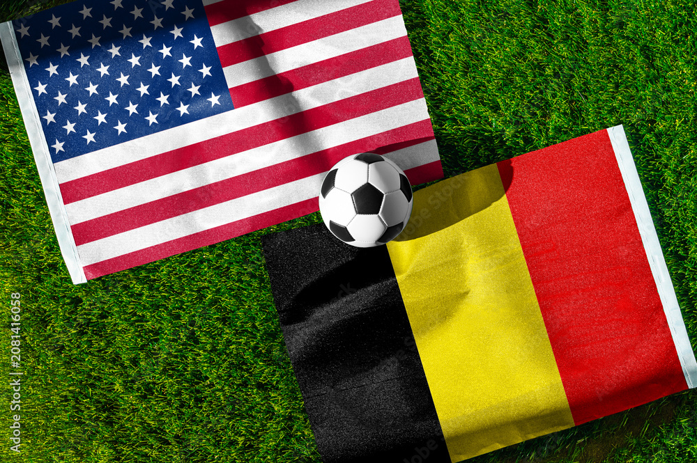 Fototapeta premium United States vs Belgium, national flags before international football match, football on green grass with stadium in the background, Lumen Field, Seattle, United States, July 6, 2026
