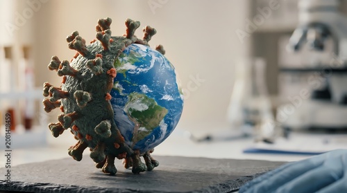 Virus and Earth globe model on table in laboratory setting with blurred medical equipment