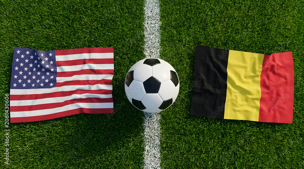 Obraz premium Flat Lay View of Soccer Ball on White Field Line Between United States and Belgium Flags on Green Grass Pitch