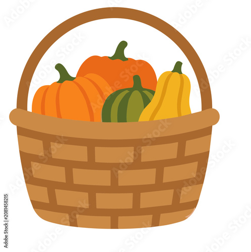Bild auf Leinwand Woven wooden basket filled with harvested pumpkins and gourds