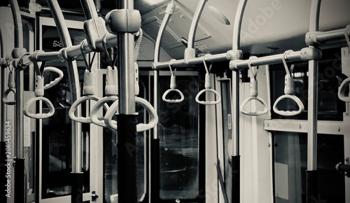 Photos Handrails and rings in a public transport interior: monochrome urban detail