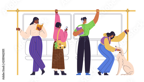 Passengers standing in subway train car, holding handrails, reading book, wit...