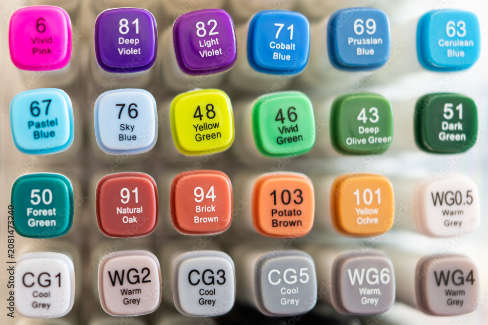 Obraz premium Close up of colorful alcohol markers set. Bright caps with numbers and color names for drawing and art.