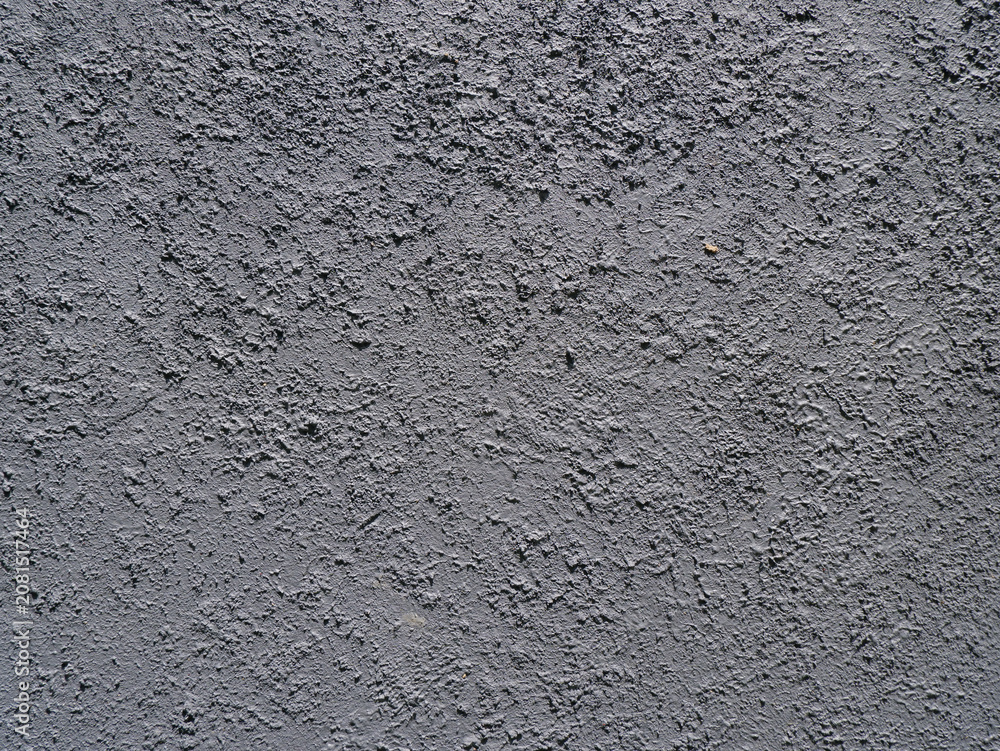 Obraz premium Rough concrete wall texture background with coarse stucco cement finish for industrial interior design or architecture backdrop