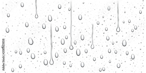 Foto Vertical water streaks and droplets on a transparent window with raindrops dropl