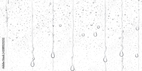 Fotografie Vertical rain trails and water droplets on glass background with droplets transp