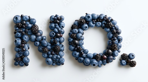 Fruit arranged to spell the word No on a white surface