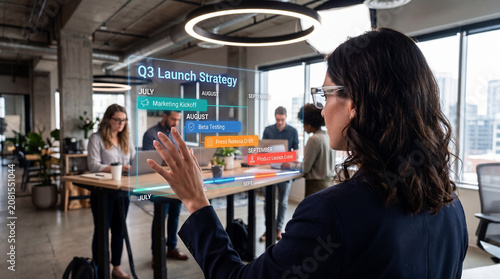 A woman wearing AR glasses interacts with a holographic timeline interface in a modern coworking space with people working at desks in the background.