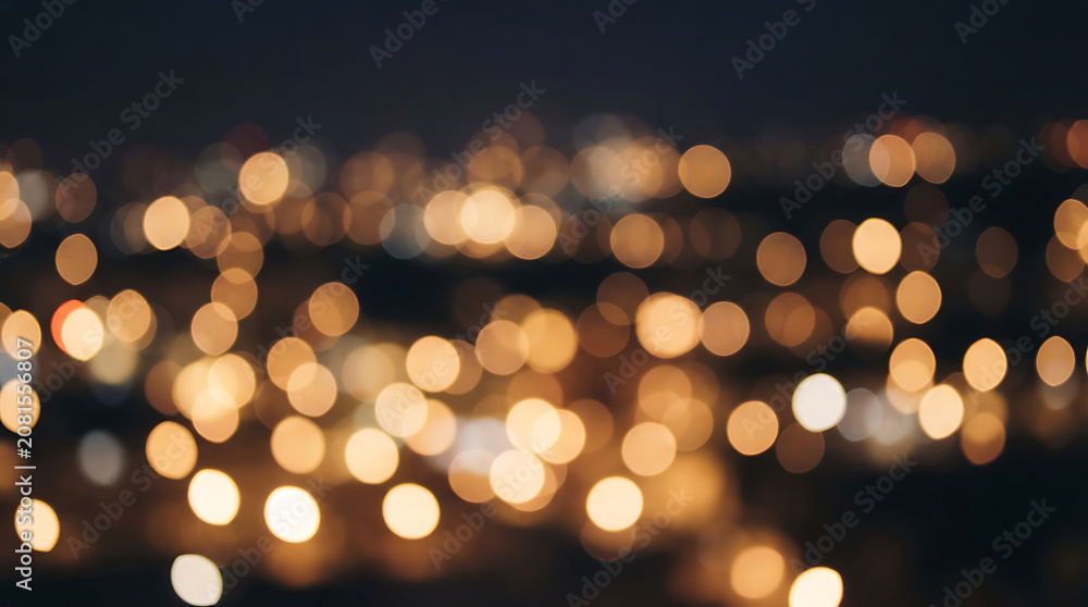 Fototapeta premium Blurred city lights at night dark background with bokeh effect