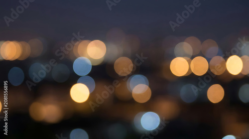 Blurred circular lights dark background out of focus city scene
