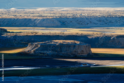 Obraz na plátně A winding seasonal riverbed carved through the vast landscapes of Tibet, China