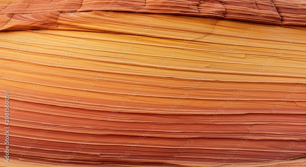 Fototapeta premium Abstract Sandstone Wave Pattern, Swirling Layers of Orange and Yellow Rock Texture