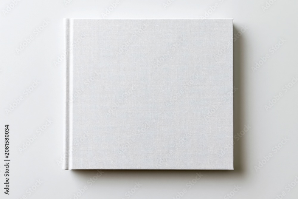 Fototapeta premium The White Notebook Flat Lay on Minimalist White Background with Subtle Shadow