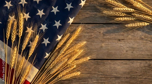 American flag with golden wheat ears on rustic wooden table background