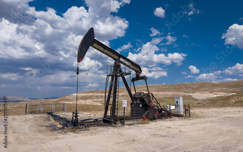 Aerial View of Oil Pumpjack in Rural Landscape – Petroleum Extraction and Fossil Energy Production Site
