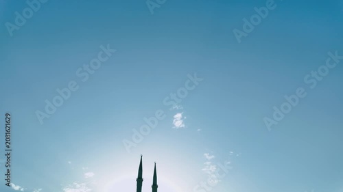Silhouetted mosque and minarets at sunset in Sharm El Sheikh Egypt beneath dramatic clouds and deep blue sky creating a peaceful Islamic architectural and spiritual travel scene