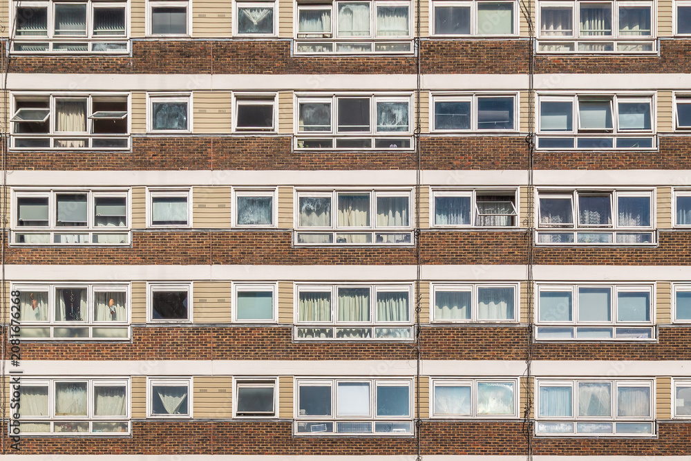 Fototapeta premium Council apartment block facade with repeating windows on the York Way Estate in Islington, London, UK