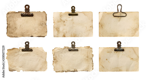 Vintage collection of old, stained paper pieces with paper clips with torn edges of lining papers, isolated on a transparent Background PNG
