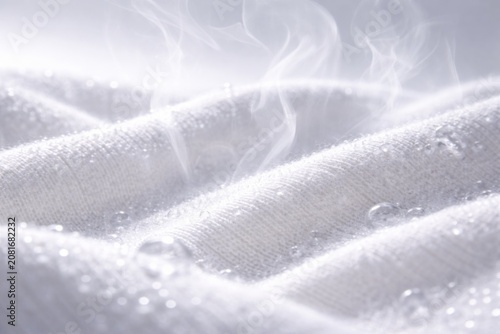 Steam rising from freshly washed white laundry fabric, background, 3875 laundry