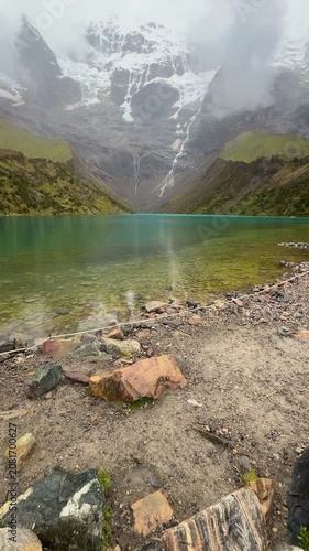 Humantay lake showcasing turquoise water and snowy peaks
