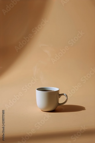 Coffee Cup With Steam on a Beige Background in a Bright Indoor Setting