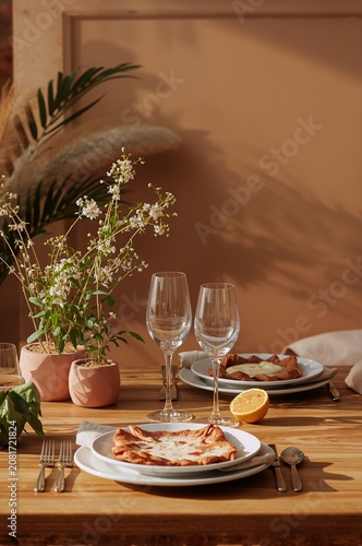 Table Set for a Meal With Two Plates of Food and Two Glasses at a Restaurant ...