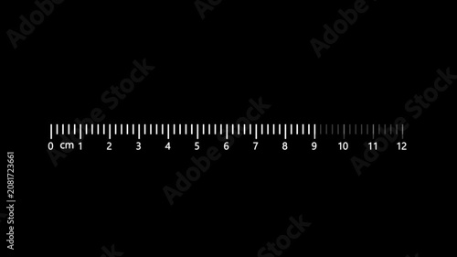 A ruler with centimeter markings from 0 to 12 on the white background count counting