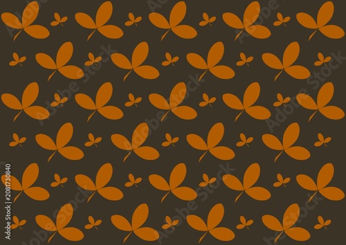 Orange brown leaf silhouettes seamless pattern on dark background, autumn botanical nature repeat illustration.