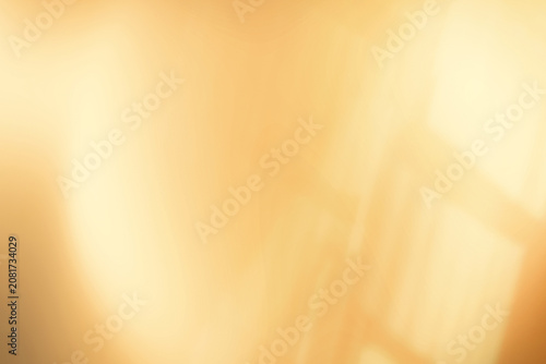 Abstract warm gold bokeh background with window shadow overlay